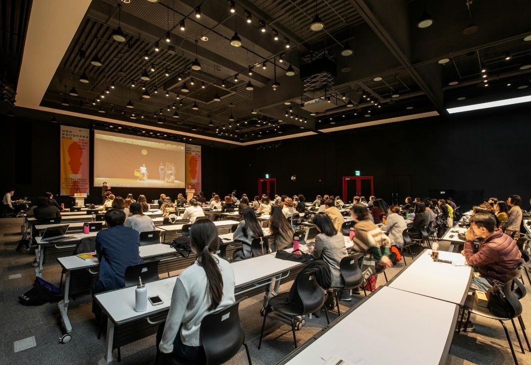 The press conference venue was meticulously set up, featuring a prominently displayed branded backdrop.